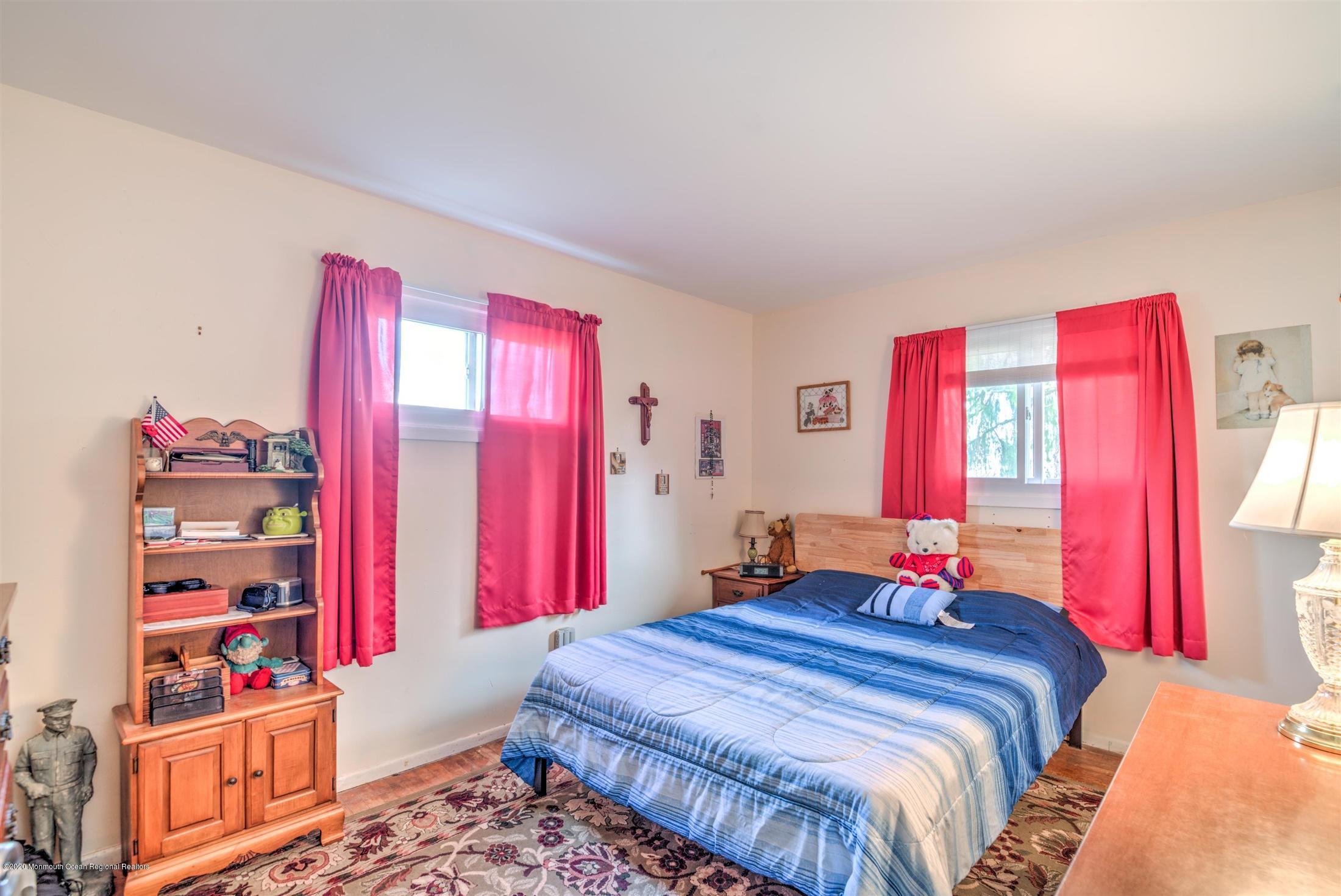 60 Mallard Road Bayville, NJ 08721 - Photo 12 of 20 a bedroom with a bed and a window
