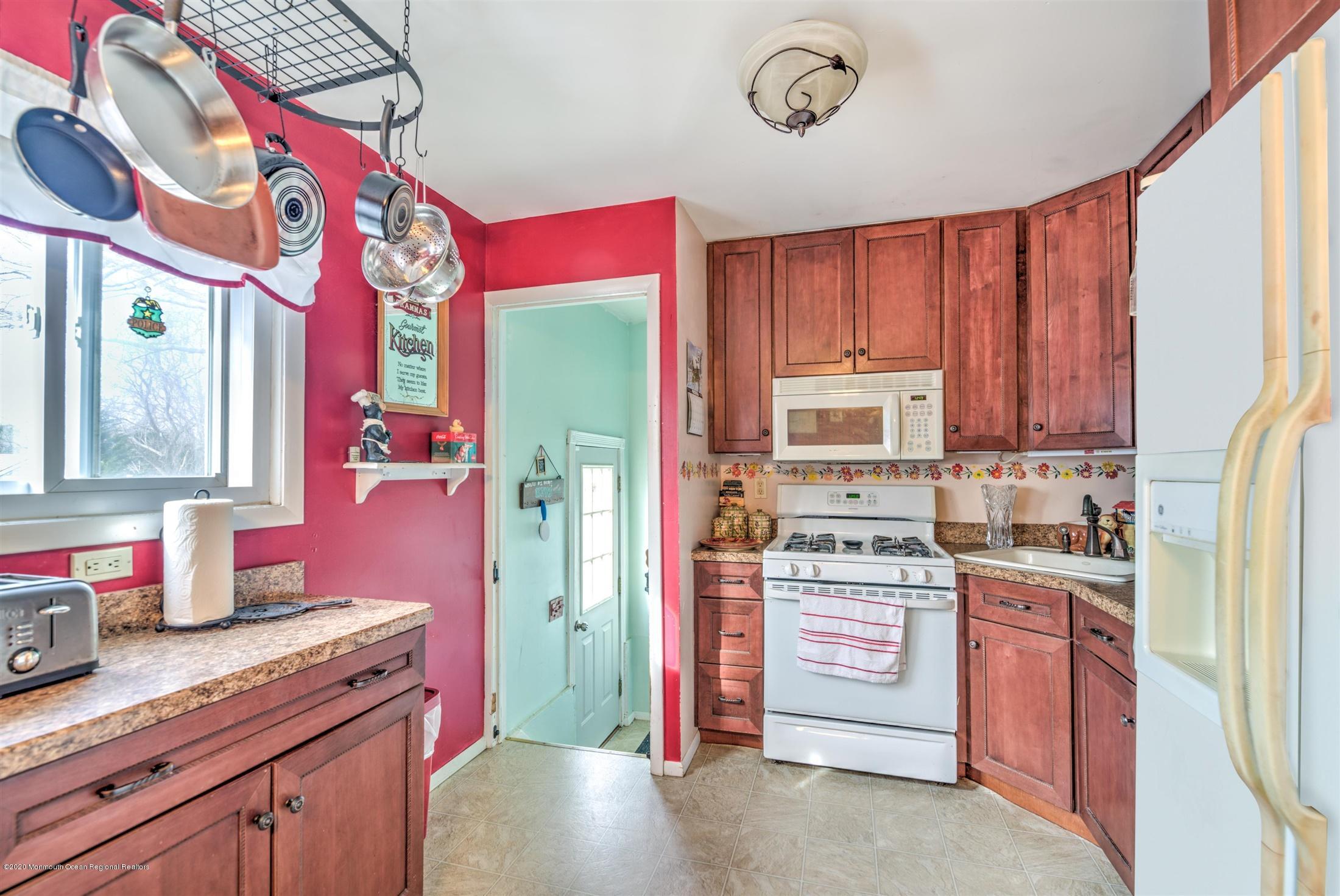 60 Mallard Road Bayville, NJ 08721 - Photo 6 of 20 a kitchen with stainless steel appliances granite countertop a sink stove and refrigerator