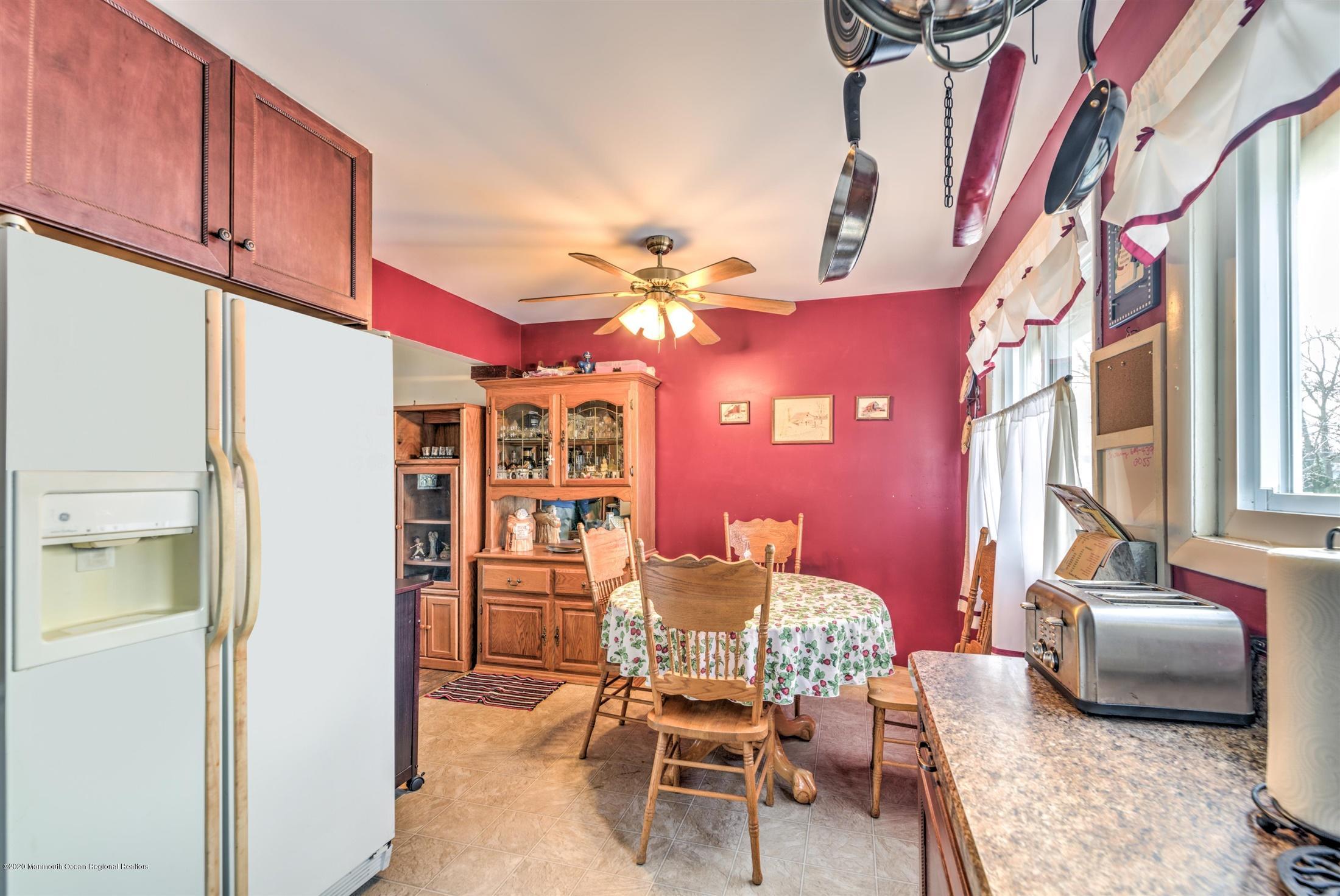 60 Mallard Road Bayville, NJ 08721 - Photo 9 of 20 a dining room with furniture and a chandelier