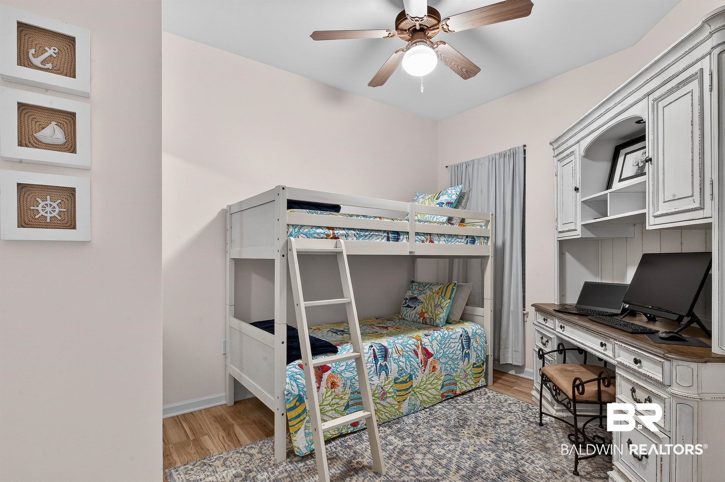 27282 Canal Road, Unit 408 Orange Beach, AL 36561 - Photo 17 of 37 Bedroom featuring a desk Bunk bed, and a ceiling fan