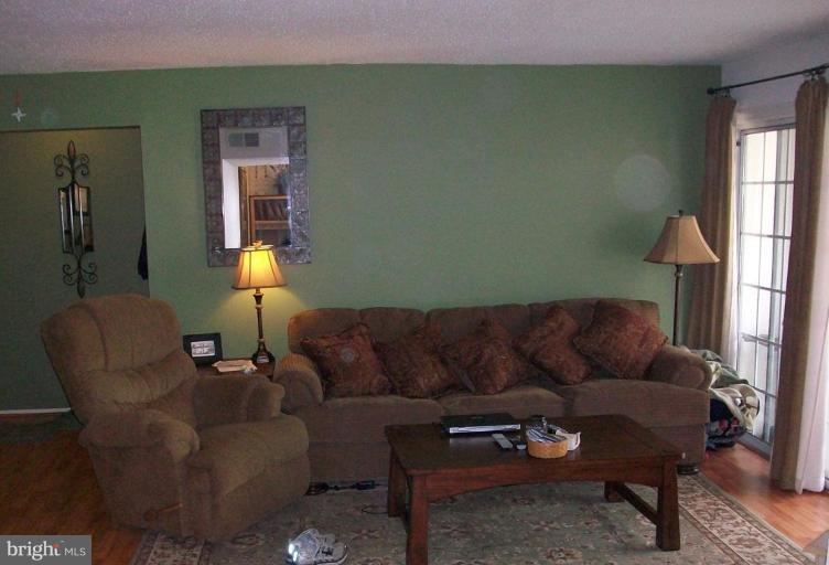 112 Fort Evans Road Southeast, Unit 54 Leesburg, VA 20175 - Photo 3 of 6 Relaxing is easy in this living room!