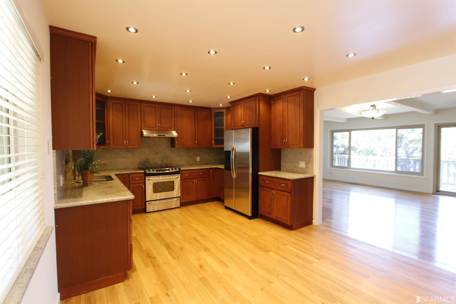 316 Alberta Way Hillsborough, CA 94010 - Photo 11 of 31 a kitchen with stainless steel appliances granite countertop a sink stove and refrigerator