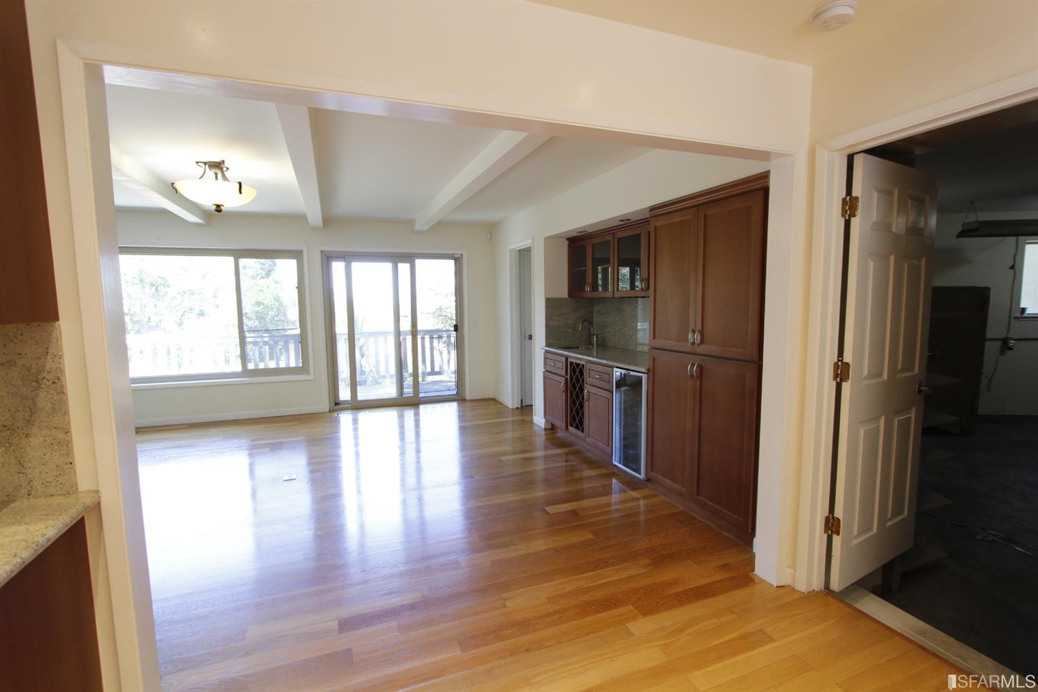 316 Alberta Way Hillsborough, CA 94010 - Photo 13 of 31 a view of a hallway with wooden floor and a living room