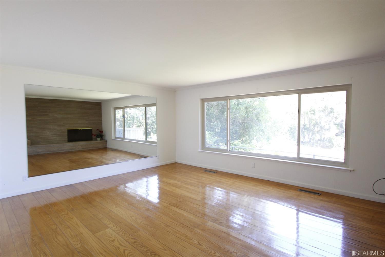 316 Alberta Way Hillsborough, CA 94010 - Photo 16 of 31 a view of empty room with window and wooden floor