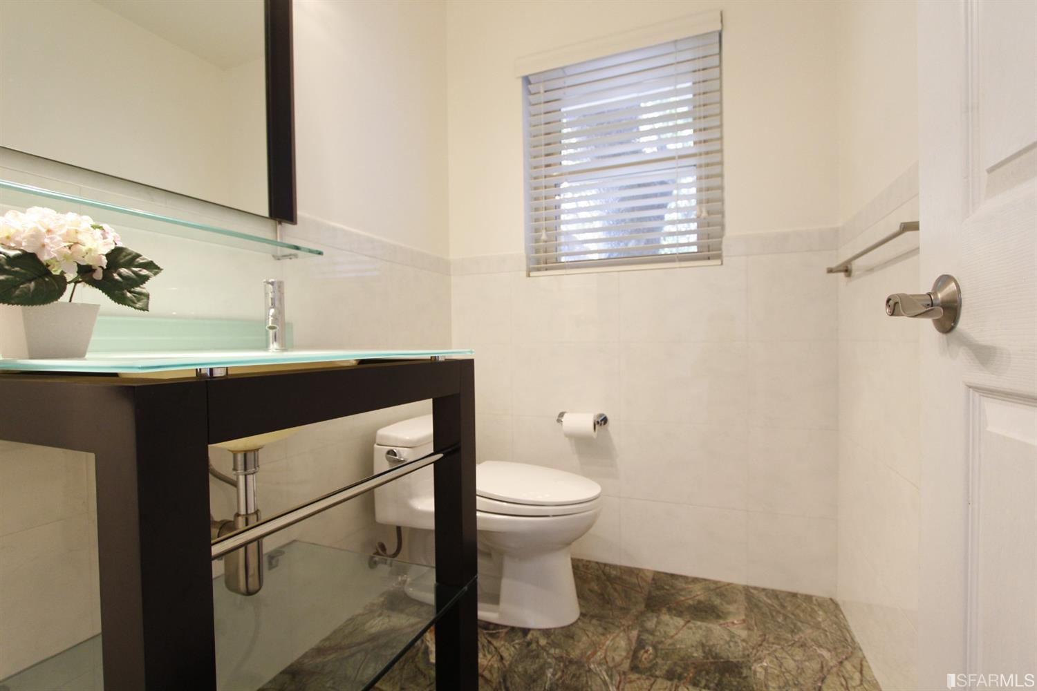 316 Alberta Way Hillsborough, CA 94010 - Photo 17 of 31 a bathroom with a sink toilet and a mirror
