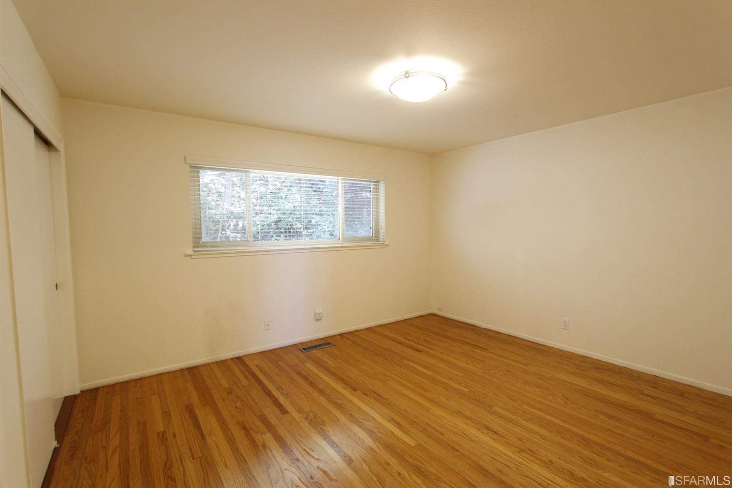 316 Alberta Way Hillsborough, CA 94010 - Photo 20 of 31 a view of empty room with wooden floor
