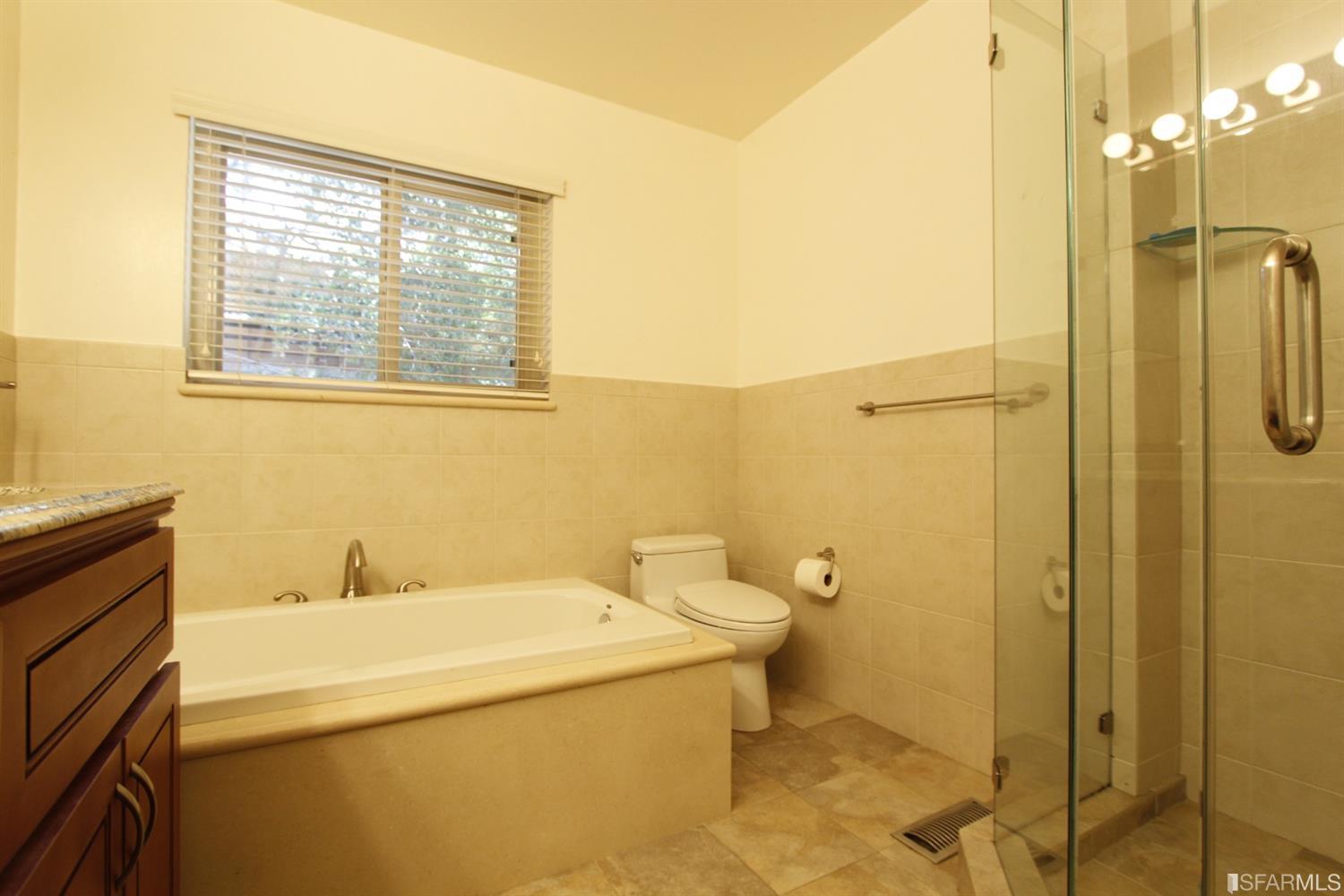 316 Alberta Way Hillsborough, CA 94010 - Photo 21 of 31 a bathroom with a sink a toilet and shower
