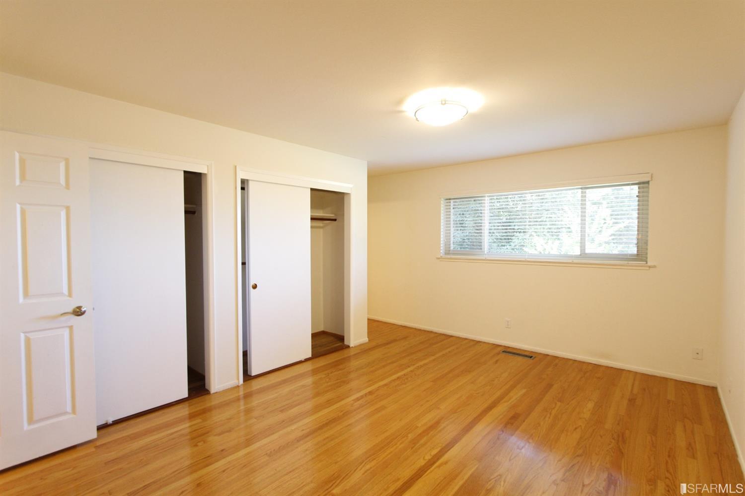 316 Alberta Way Hillsborough, CA 94010 - Photo 23 of 31 a view of empty room with wooden floor and fan