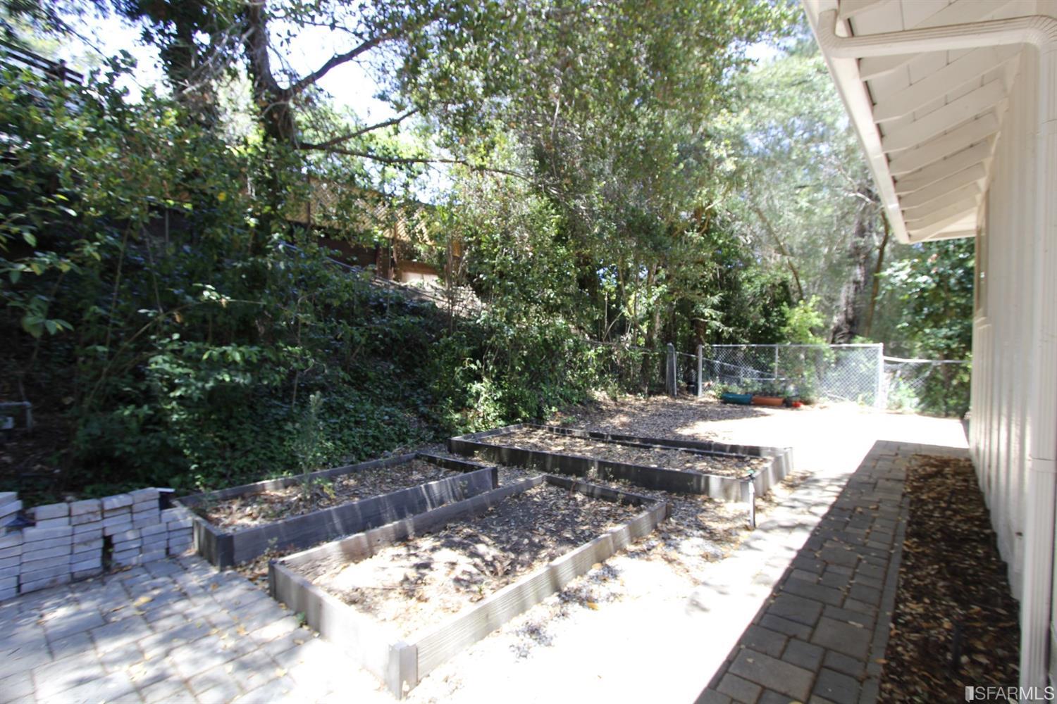 316 Alberta Way Hillsborough, CA 94010 - Photo 27 of 31 a view of a backyard with large trees