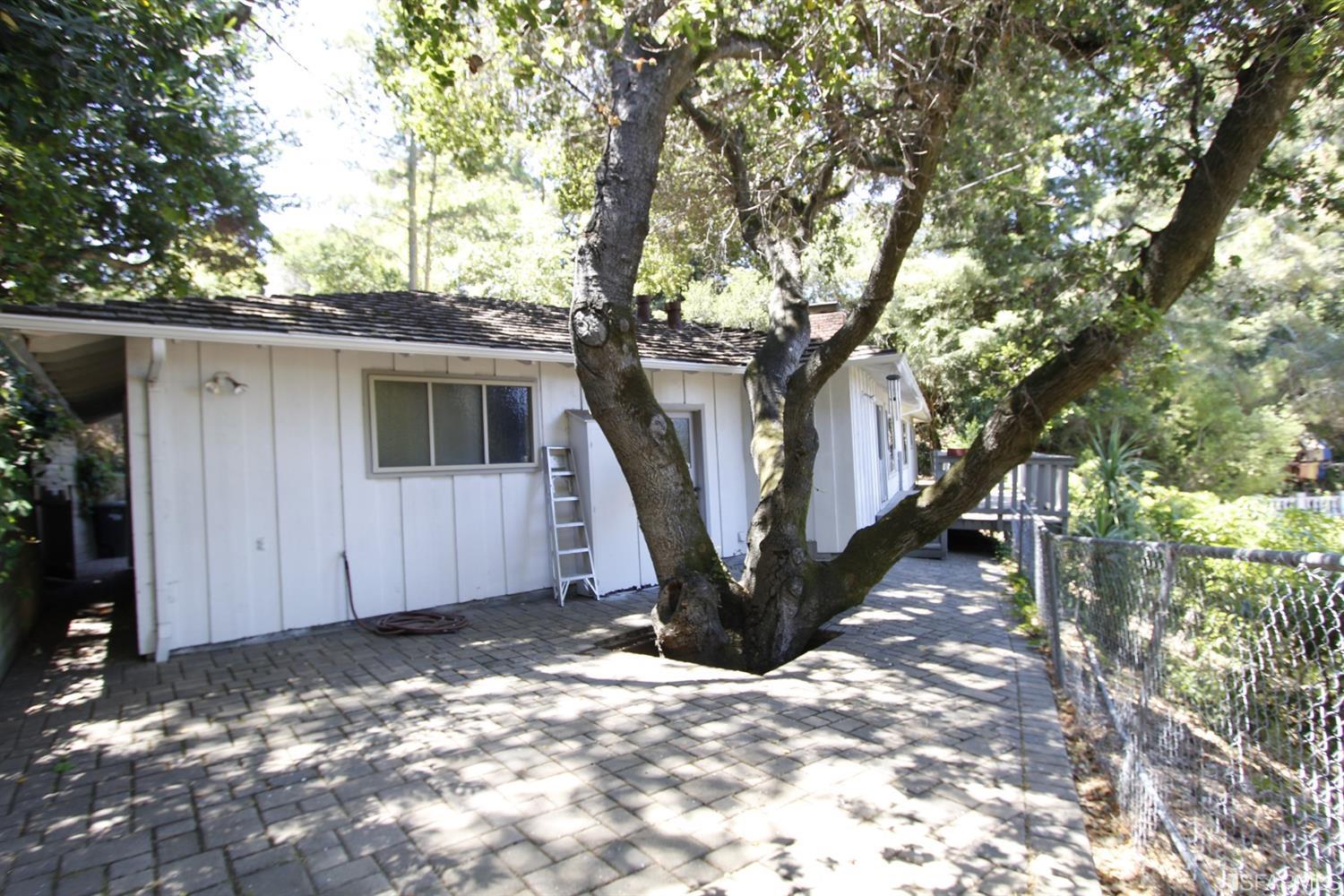 316 Alberta Way Hillsborough, CA 94010 - Photo 28 of 31 a view of a house with a tree in the background