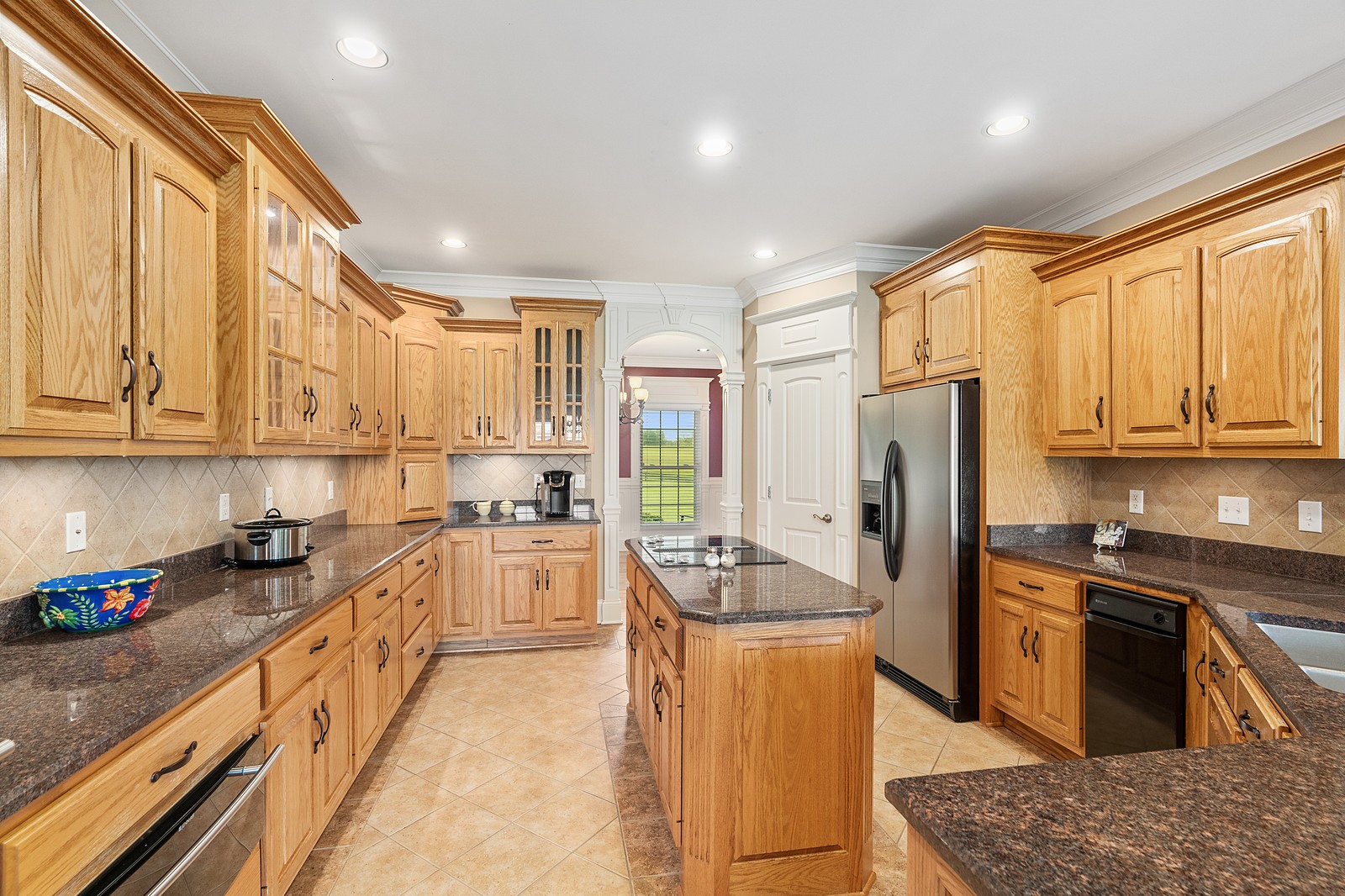 288 Lee Road Cottontown, TN 37048 - Photo 11 of 47 a kitchen with stainless steel appliances granite countertop a refrigerator a sink dishwasher a stove and white cabinets with wooden floor