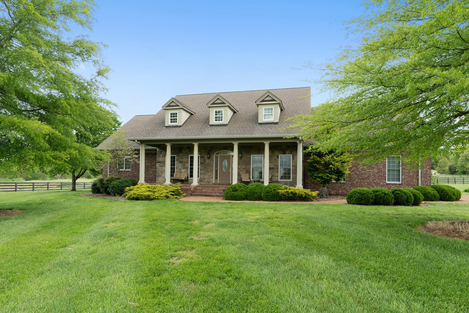 288 Lee Road Cottontown, TN 37048 - Photo 2 of 47 a front view of a house with a yard and porch