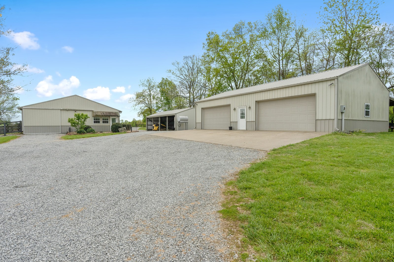 288 Lee Road Cottontown, TN 37048 - Photo 28 of 47 a backyard of a house with large trees and brick walls