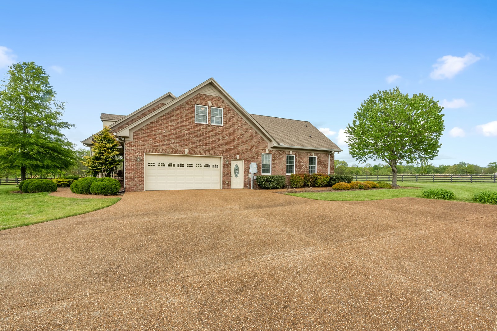 288 Lee Road Cottontown, TN 37048 - Photo 3 of 47 a front view of a house with a yard and garage