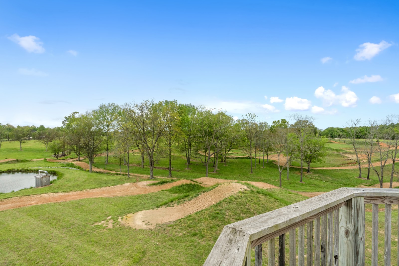 288 Lee Road Cottontown, TN 37048 - Photo 45 of 47 a view of a golf course with a lake