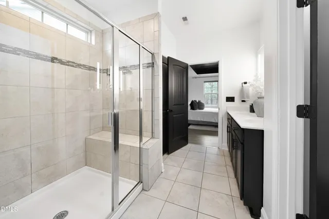 a bathroom with a bathtub and a shower