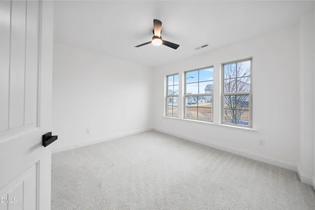 a bathroom with a bathtub sink vanity and mirror