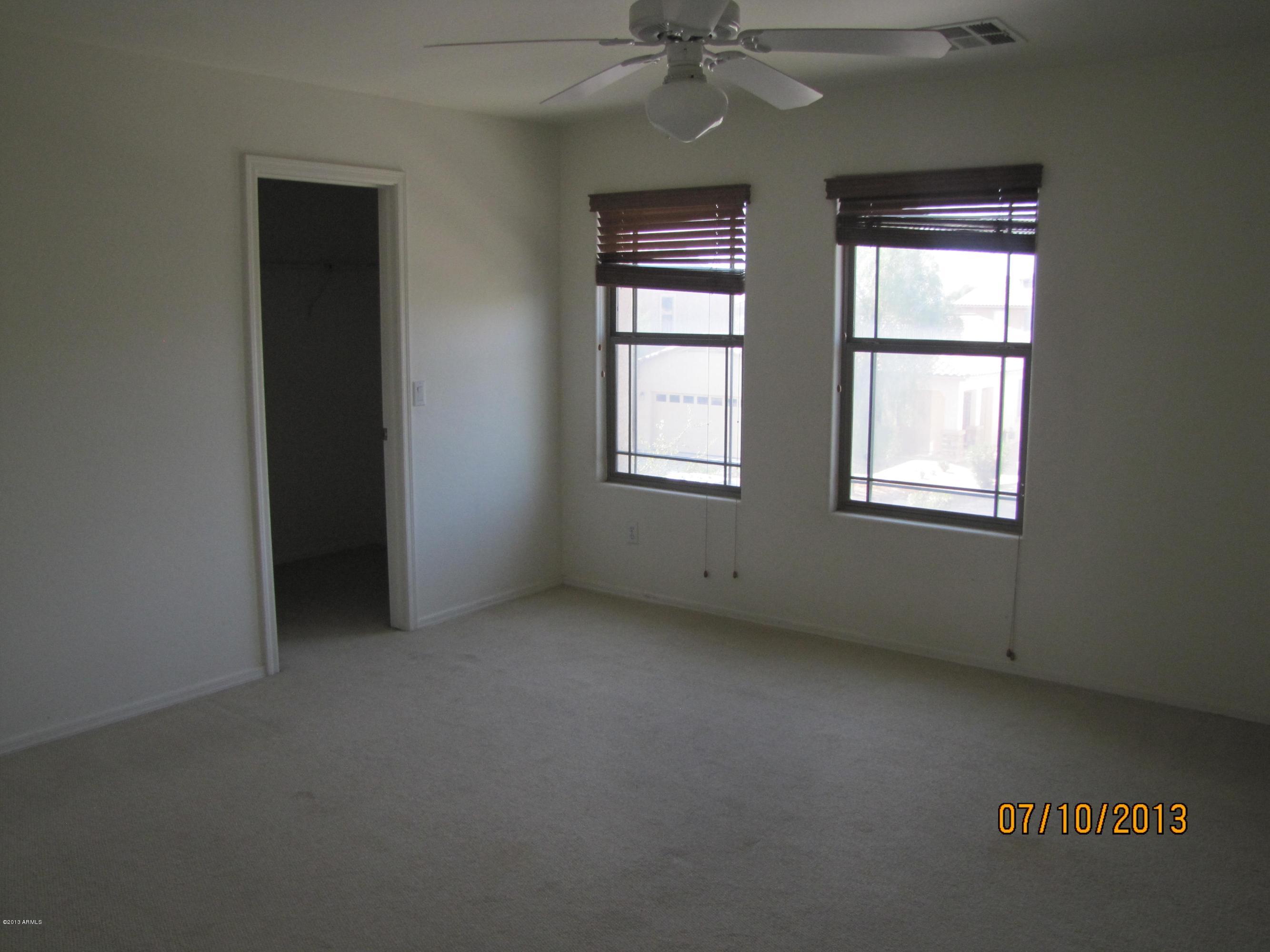 44134 Roth Road Maricopa, AZ 85138 - Photo 11 of 13 an empty room with windows and closet