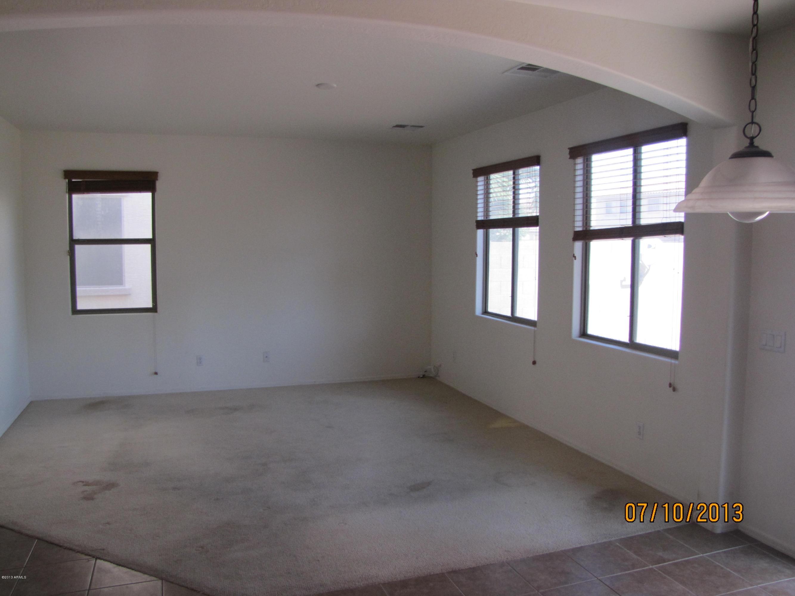 44134 Roth Road Maricopa, AZ 85138 - Photo 3 of 13 an empty room with windows