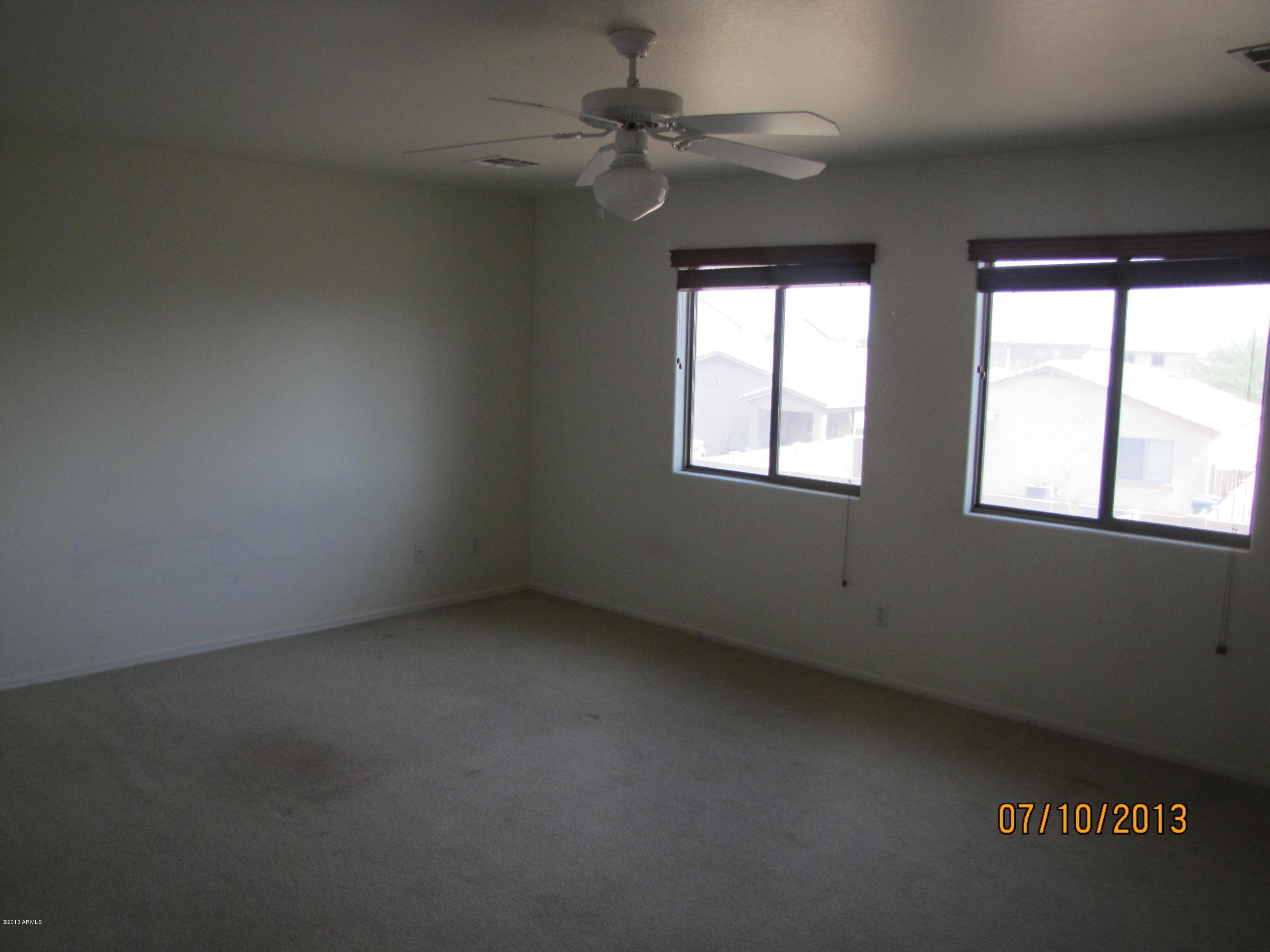 44134 Roth Road Maricopa, AZ 85138 - Photo 6 of 13 an empty room with a window