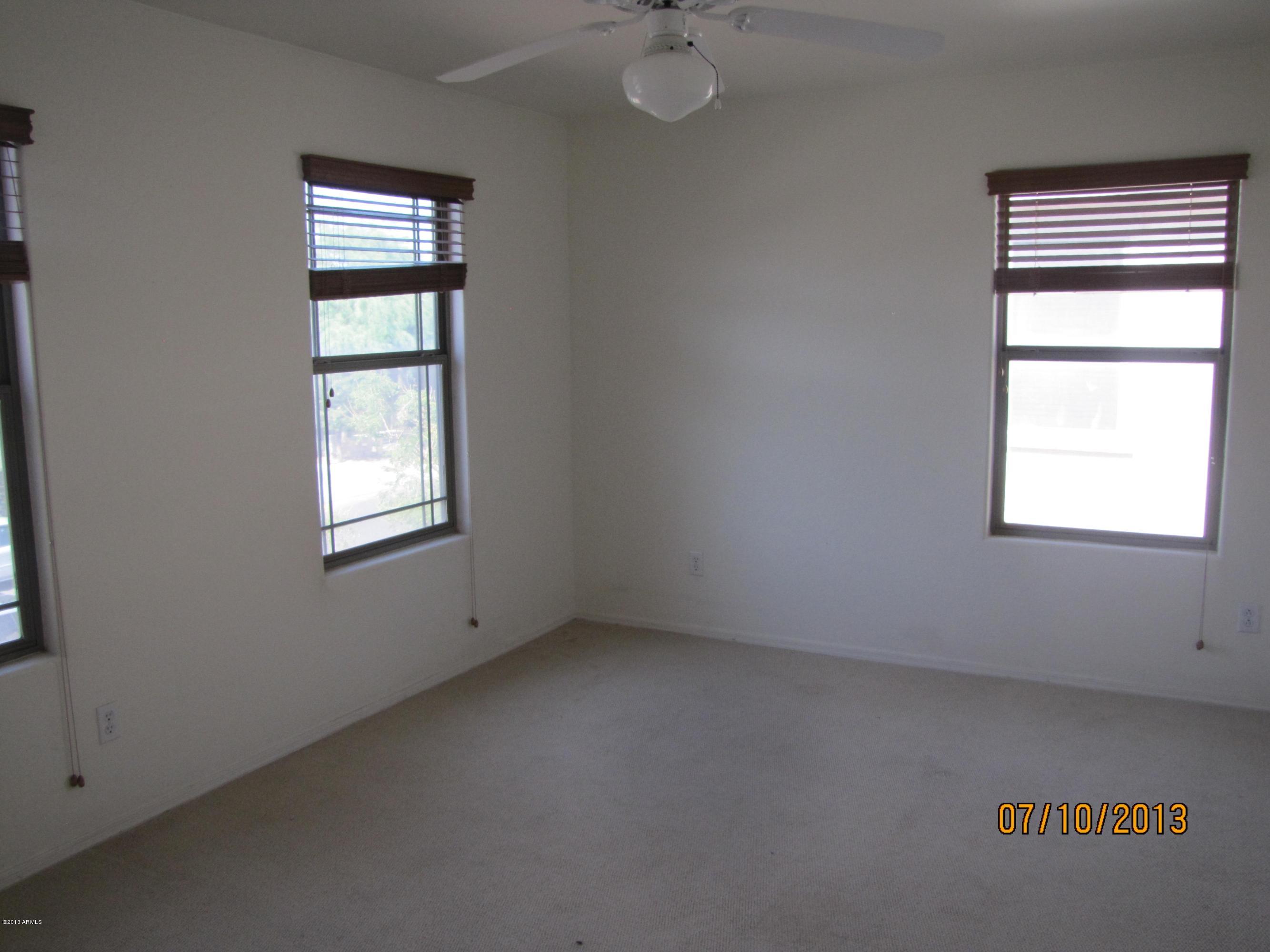 44134 Roth Road Maricopa, AZ 85138 - Photo 10 of 13 an empty room with a window