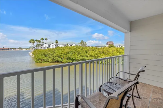 a view of a balcony with chair and table