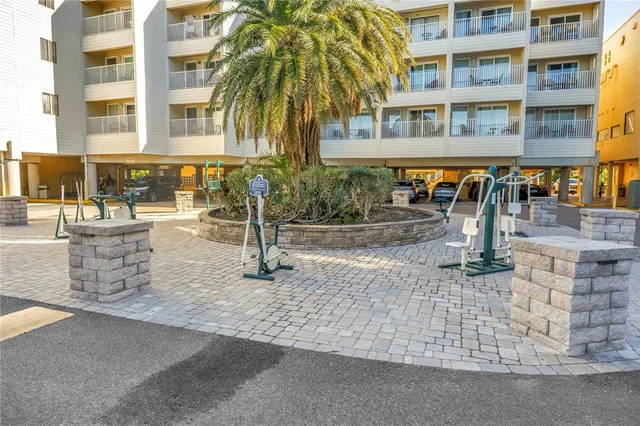 a view of a swimming pool with outdoor seating