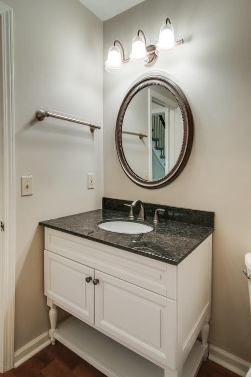 931 General George Patton Road Nashville, TN 37221 - Photo 12 of 22 a bathroom with a granite countertop sink a mirror and