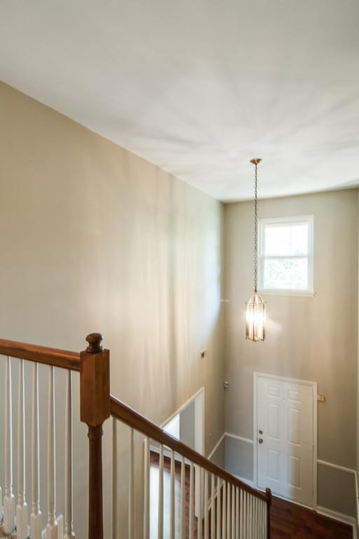 931 General George Patton Road Nashville, TN 37221 - Photo 13 of 22 a view of a hallway with a chandelier