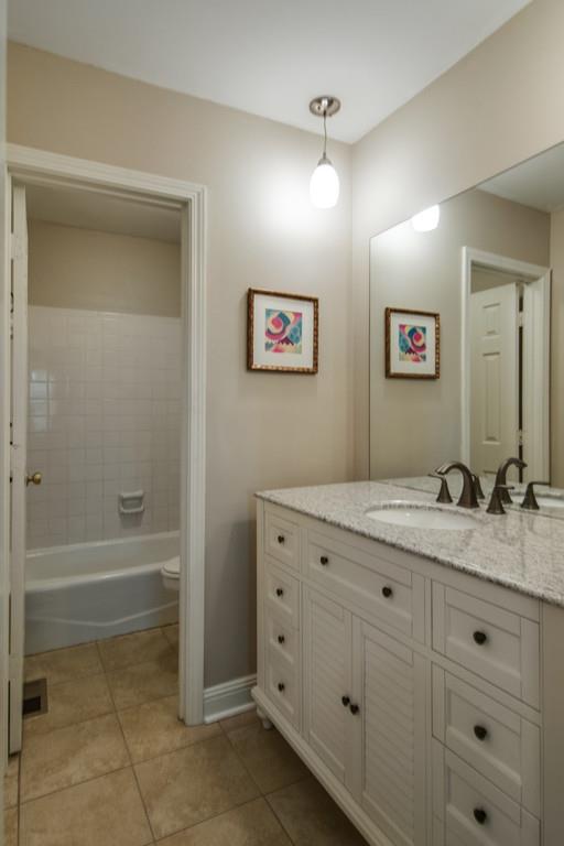 931 General George Patton Road Nashville, TN 37221 - Photo 15 of 22 a bathroom with a granite countertop sink mirror and bathtub