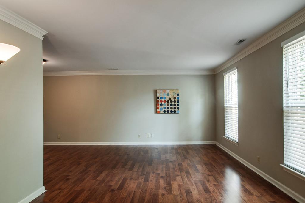 931 General George Patton Road Nashville, TN 37221 - Photo 4 of 22 an empty room with wooden floor and windows