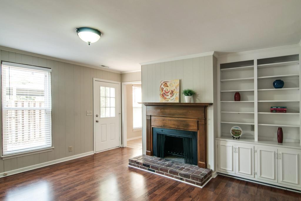 931 General George Patton Road Nashville, TN 37221 - Photo 10 of 22 a living room with a fireplace and a window