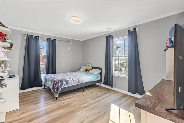 a view of a livingroom with fridge and workspace