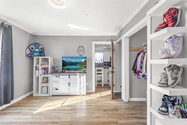 a bedroom with a bed and a view of bathroom