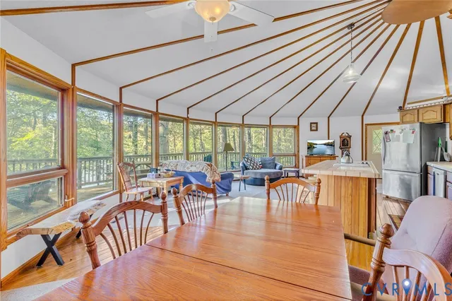 a backyard of a house with table and chairs