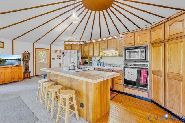 a kitchen with stainless steel appliances granite countertop a sink and cabinets