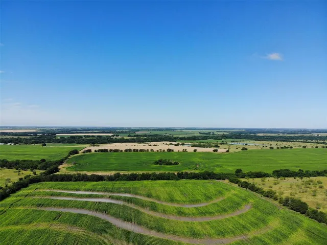 a view of a golf course with a building