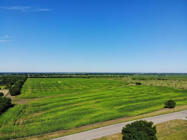 a view of a lake with a big yard