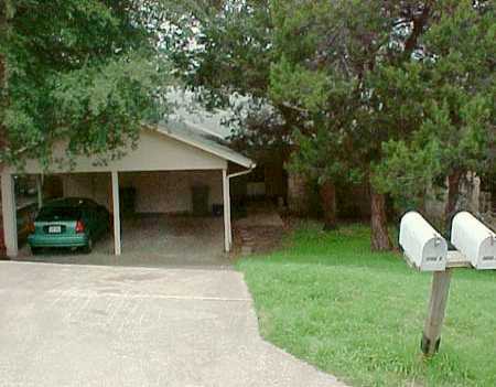 a view of a house with backyard