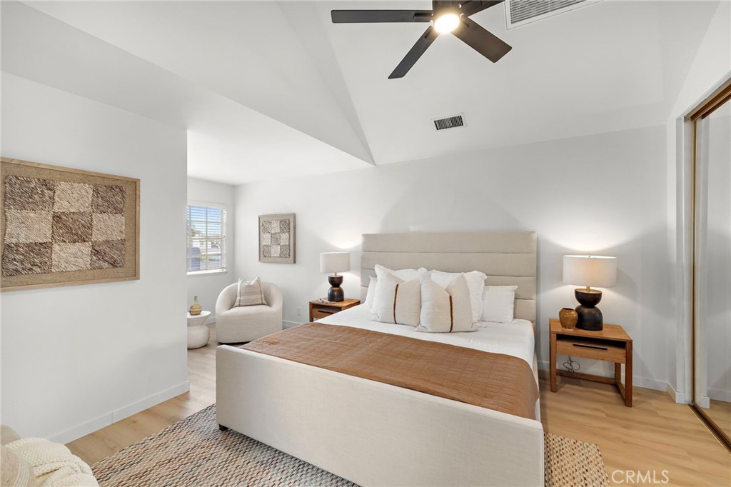 168 23rd Street, Unit D Costa Mesa, CA 92627 - Photo 13 of 26 a bedroom with a bed and a painting on the wall