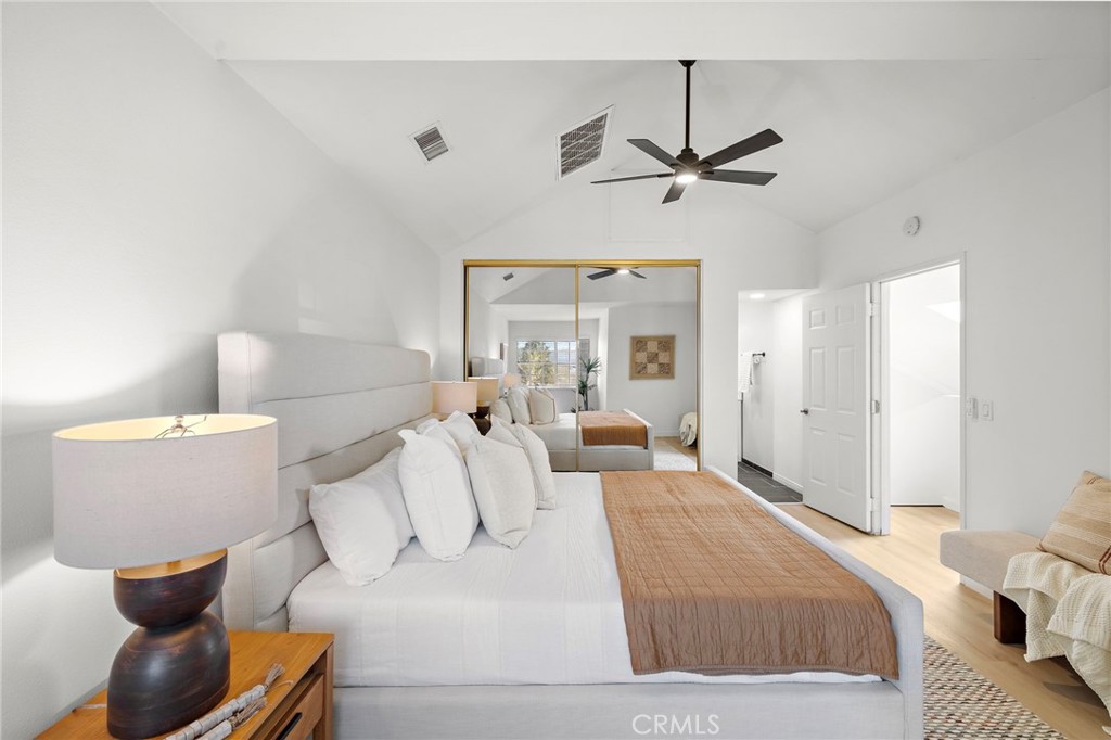 168 23rd Street, Unit D Costa Mesa, CA 92627 - Photo 14 of 26 a bed room with a bed and a couch