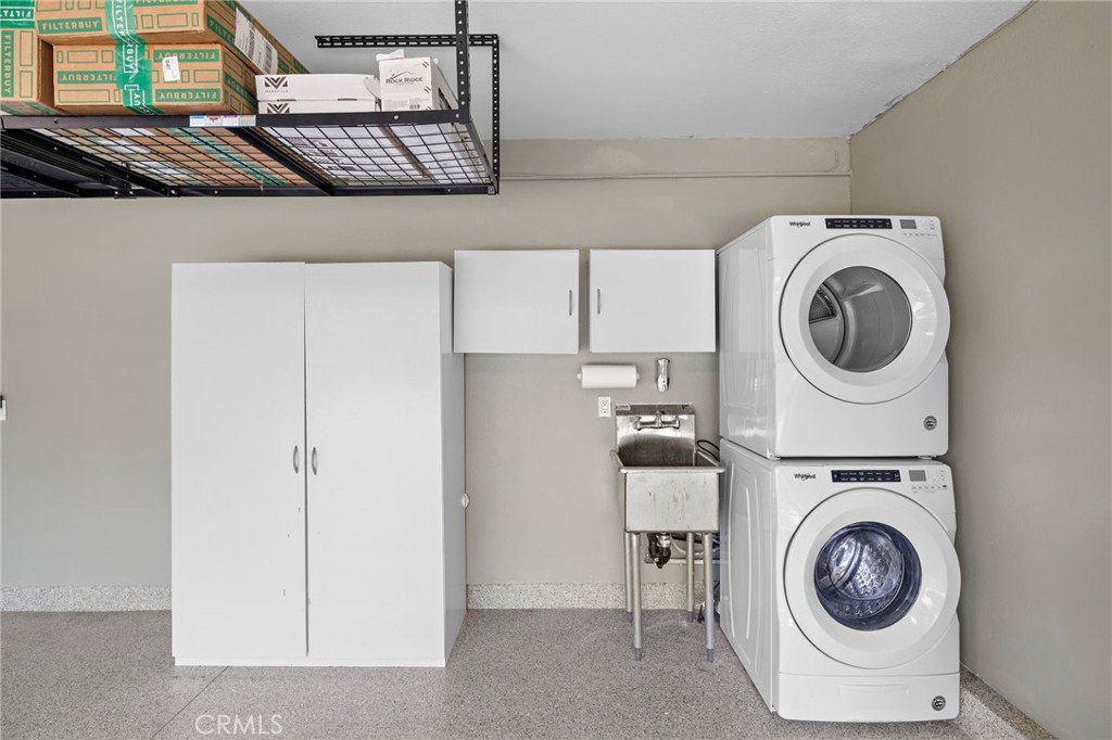 168 23rd Street, Unit D Costa Mesa, CA 92627 - Photo 24 of 26 a utility room with dryer and washer