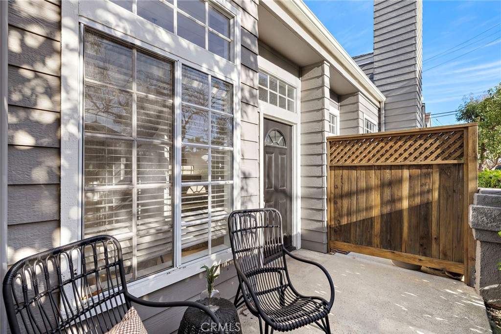 168 23rd Street, Unit D Costa Mesa, CA 92627 - Photo 25 of 26 a view of a chair and table in the balcony