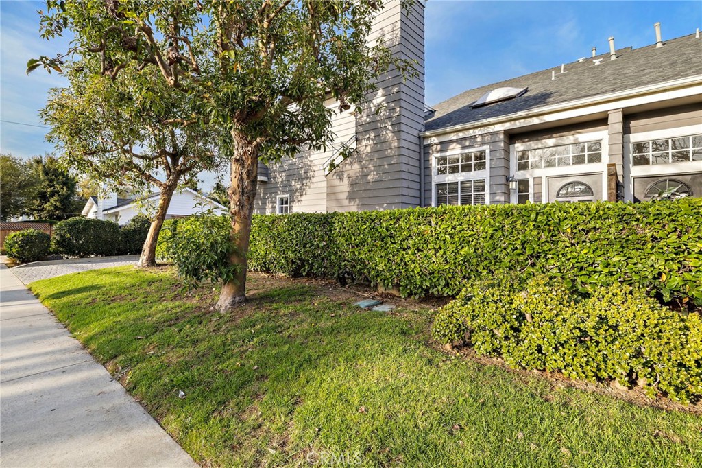 168 23rd Street, Unit D Costa Mesa, CA 92627 - Photo 26 of 26 a view of a house with a yard