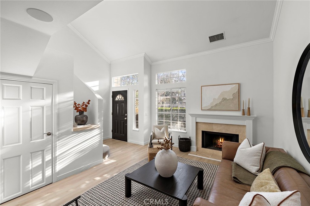 168 23rd Street, Unit D Costa Mesa, CA 92627 - Photo 4 of 26 a living room with furniture fireplace and window