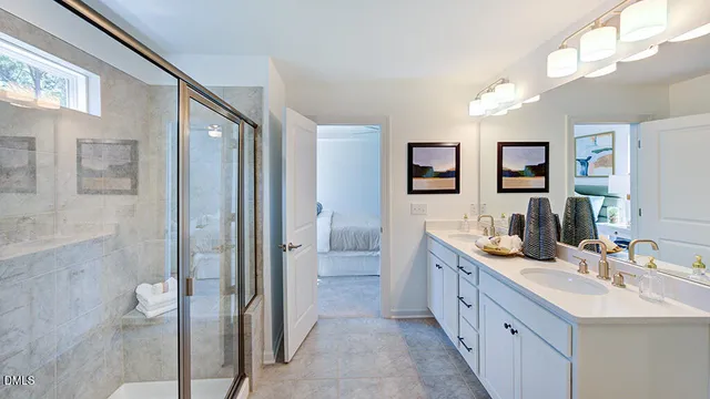 a bathroom with a double vanity sink mirror and double