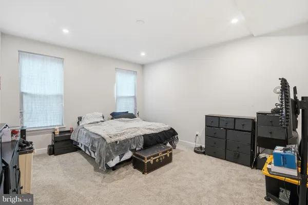 a bedroom with a bed and furniture