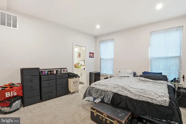 a bedroom with a bed and furniture