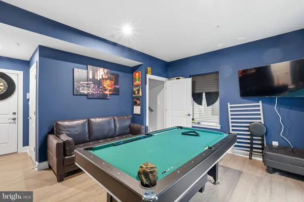 a room with furniture and flat screen tv