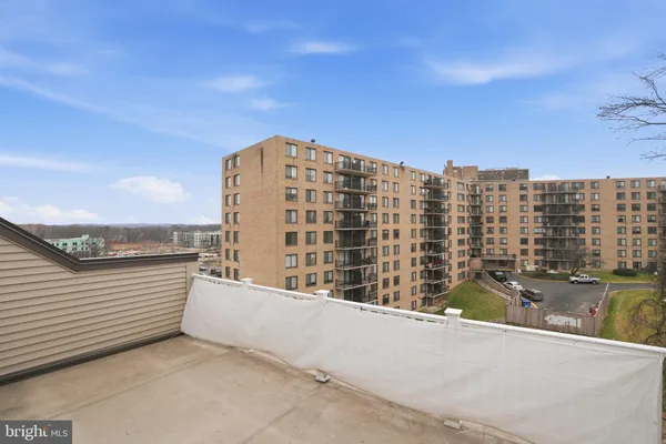 a view of a balcony with city view
